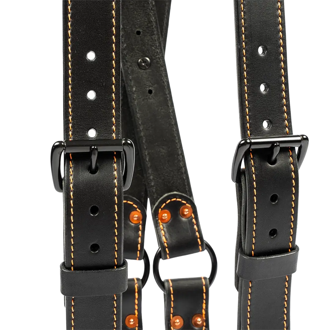 Close-up of adjustable buckle detail on leather firefighter suspenders