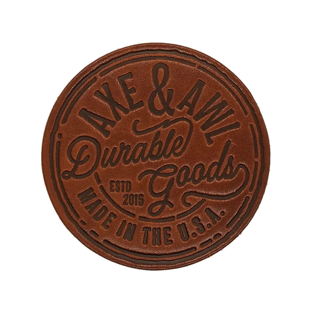 Round Leather Coaster in walnut leather with durable goods logo
