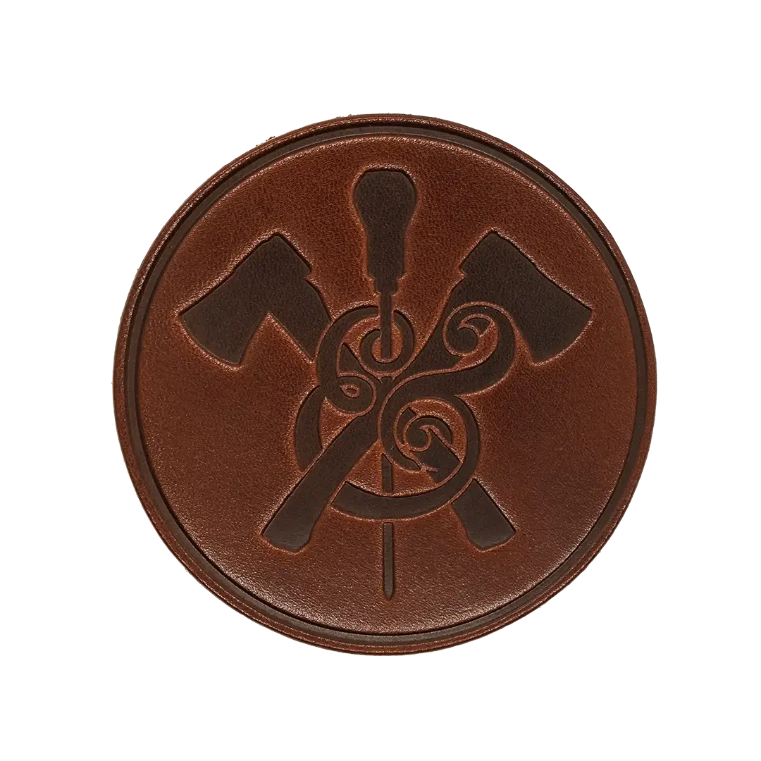 Round Leather Coaster in walnut leather with makers mark logo and outline