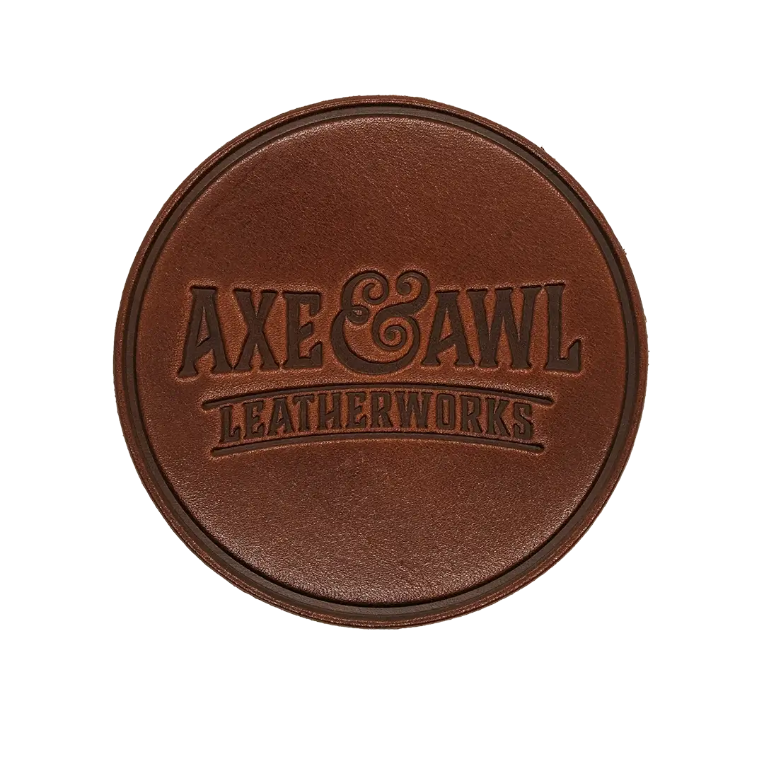Round Leather Coaster in walnut leather with word mark logo