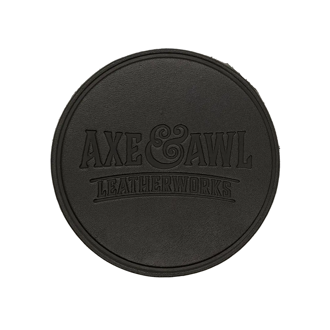 Round Leather Coaster in black leather with word mark logo