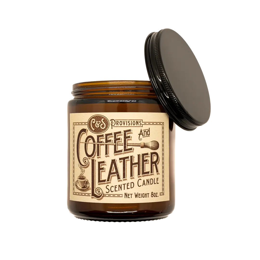 Close-up of C&S Provisions Coffee & Leather scented candle label on an amber glass jar