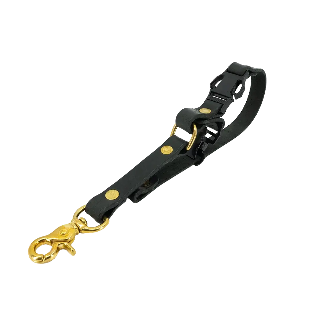 Black leather firefighter glove strap with brass hardware and adjustable buckle.