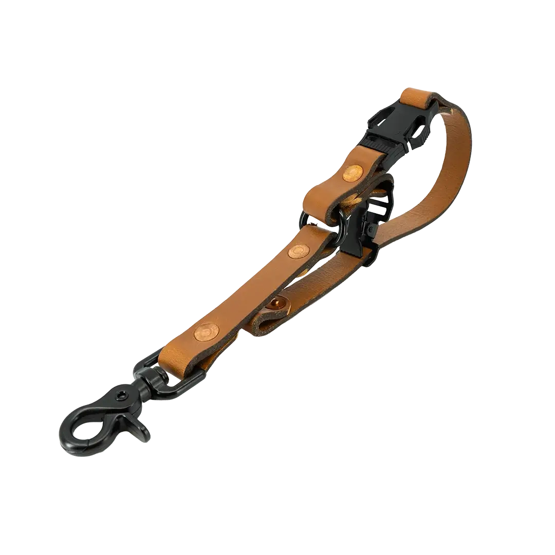 Tan leather glove strap with matte black clip and black hardware detailing.