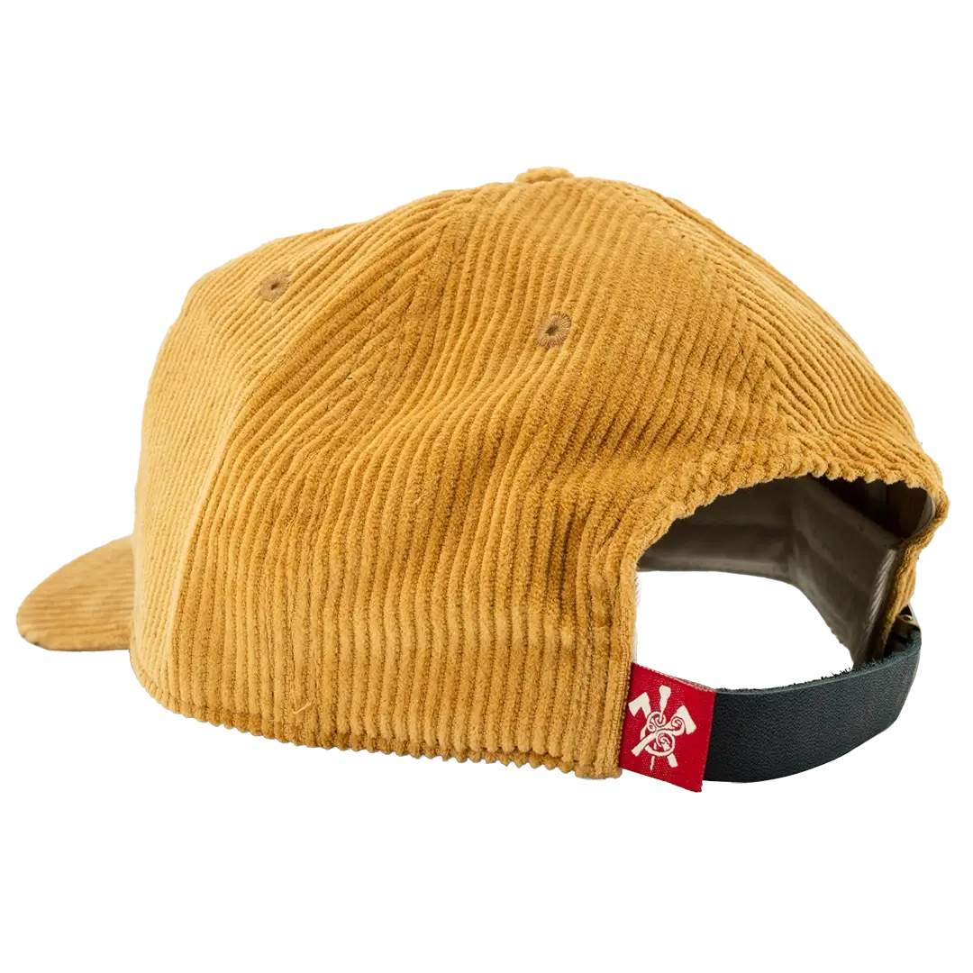 Rear view of gold corduroy hat with red woven label and leather closure