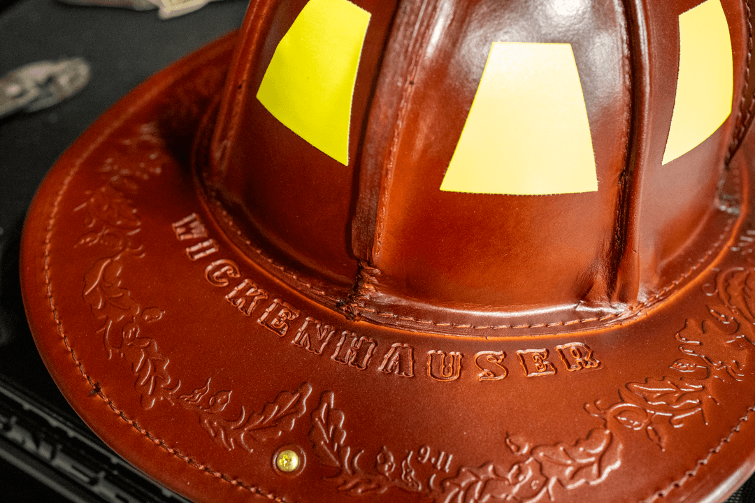 Name stamped on leather firefighter helmet