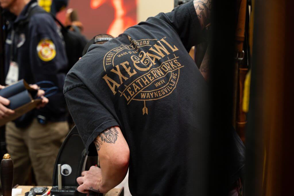 Custom stamping on leather firefighter strap at firefighter expo