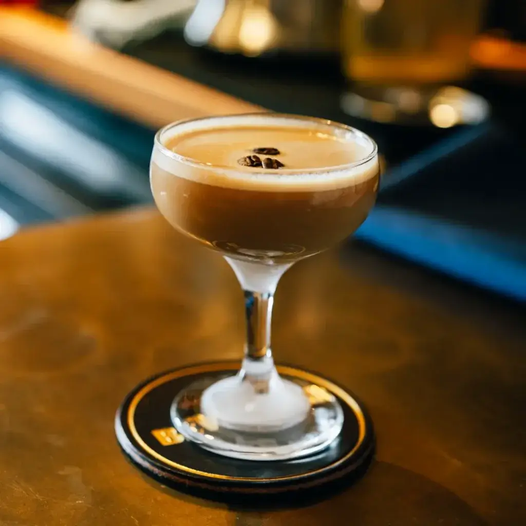 espresso martini, best espresso martini in waynesville nc seen sitting on a leather coaster that says bevel bar from axe and awl leatherworks