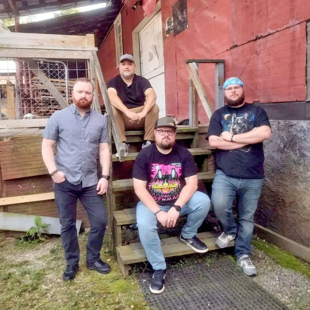An image of the band Arnold Hill on a staircase outside. 