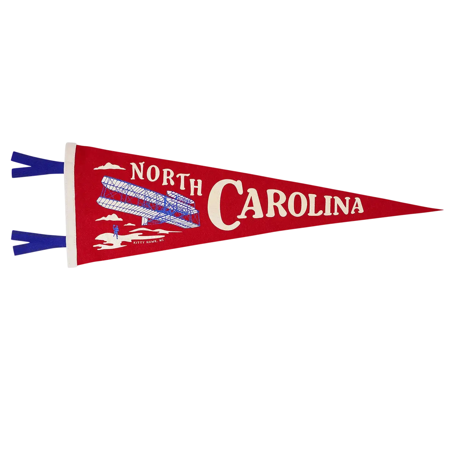 A red felt pennant with North Carolina and the Wright Brothers Flyer on it.