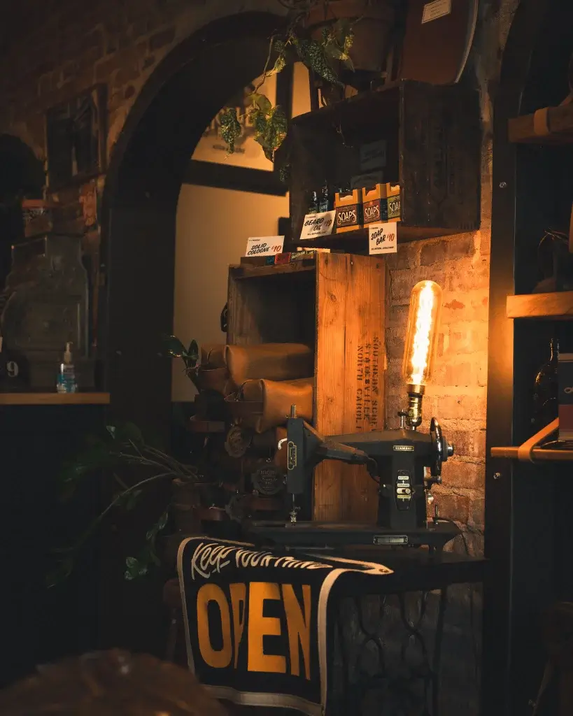 A picture of a sewing machine that has been turned into a lamp inside Axe and Awl